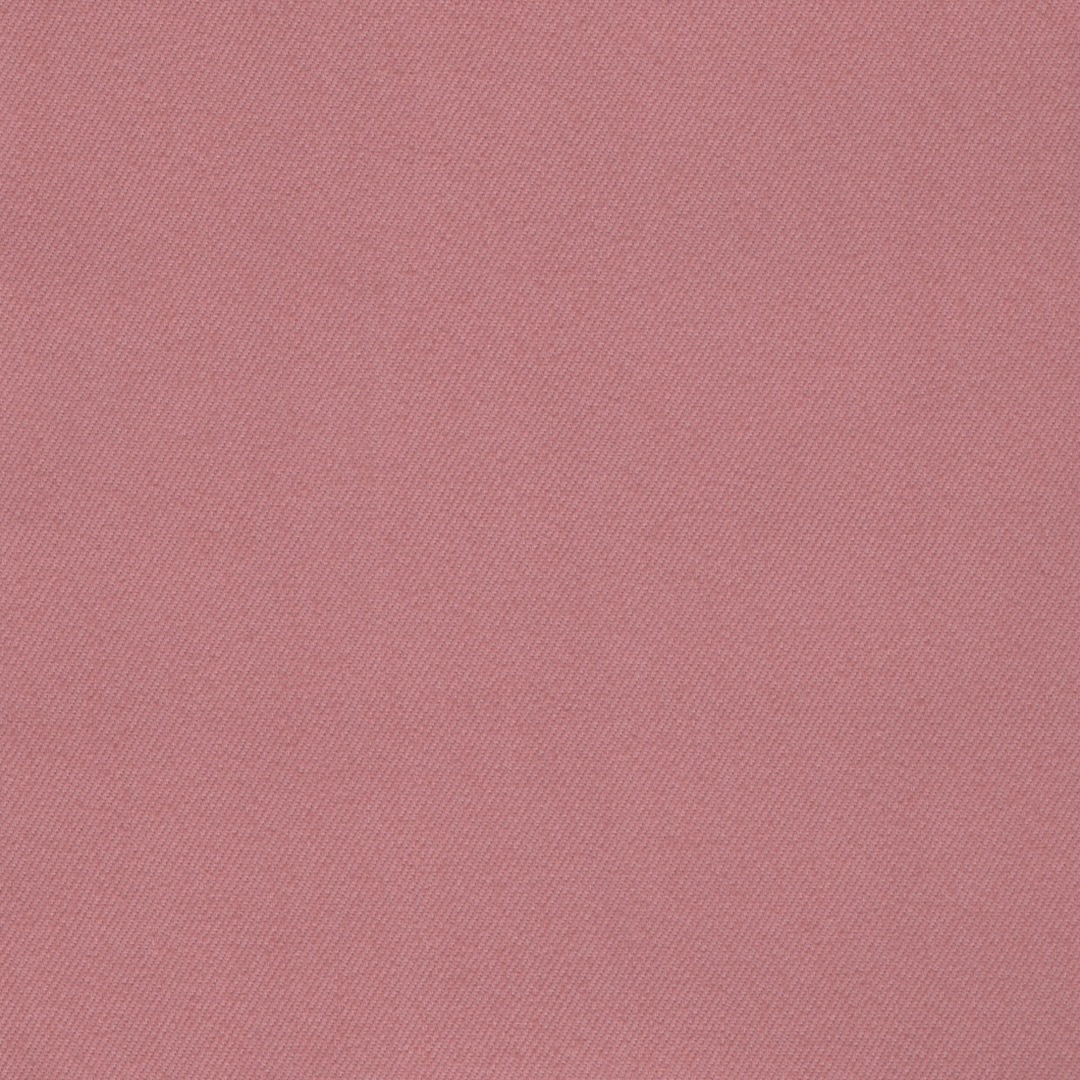 Dusty pink coloured stretch denim fabric close up