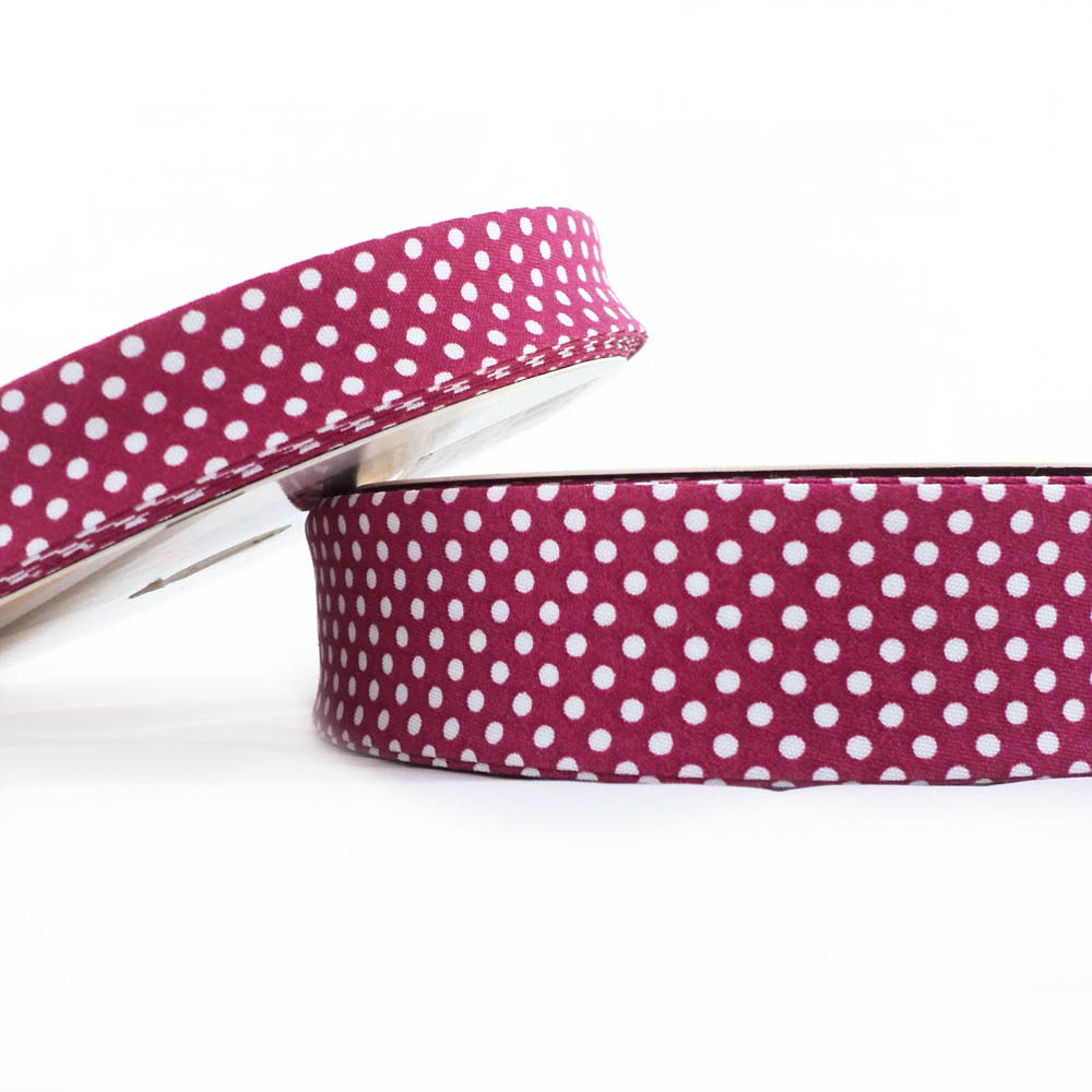 25m roll of Dot Bias Binding Tape with 30mm width in Magenta 49