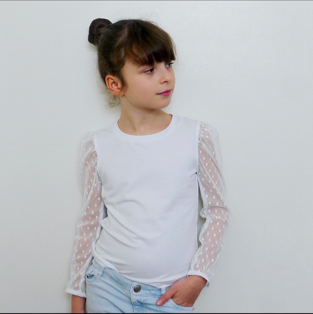 Fashion Model Wearing Ikatee Couture Sewing Pattern for Lobelia KIDS Blouse Child