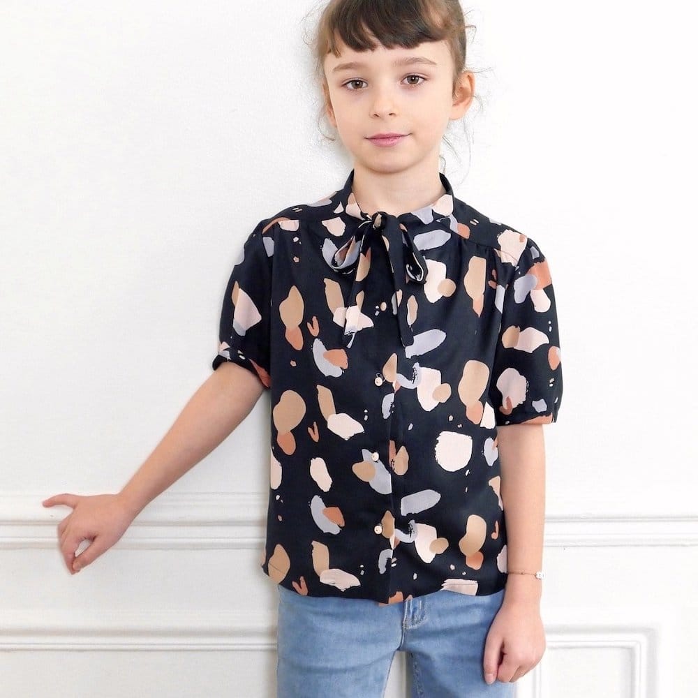 Model Wearing Ikatee Couture Sewing Pattern for Alex Blouse / Dress Kids 3/12y