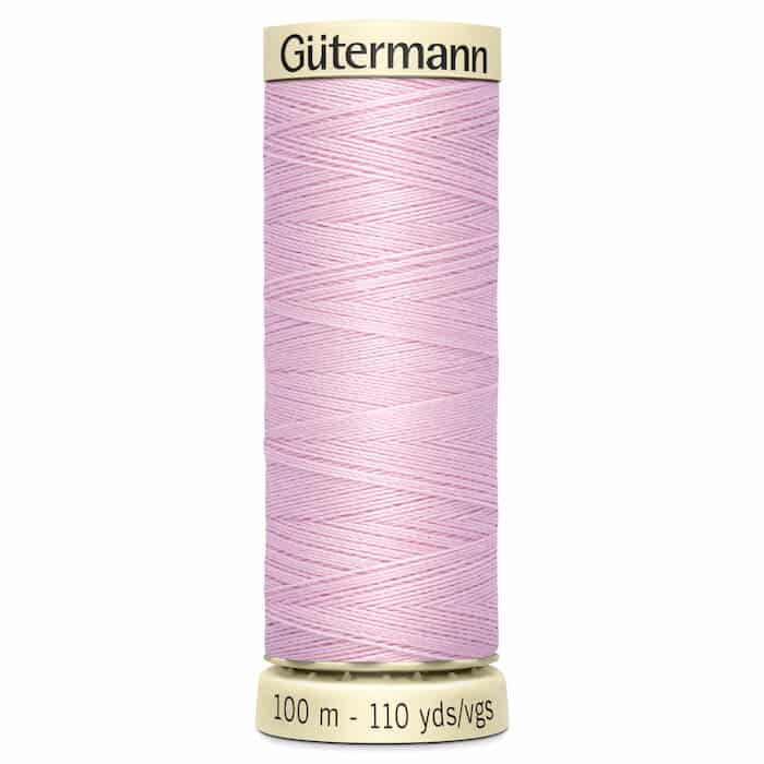 100 metre spool of Gutermann Sew-all Sewing Thread in 320 Ice Pink