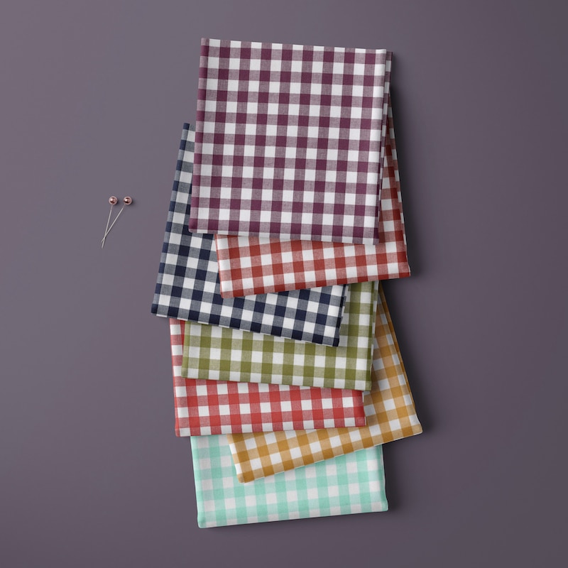 Cotton gingham fabric squares in a row in various colour ways