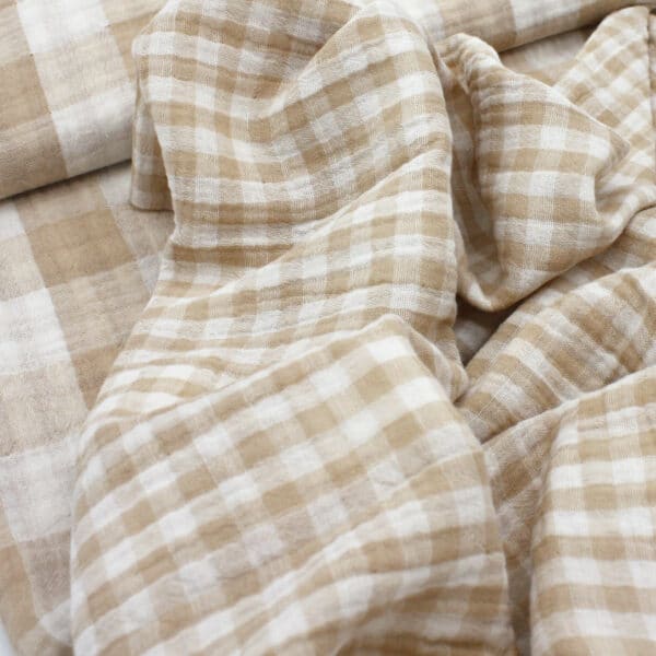 close up showing two size of gingham check in double gauze fabric