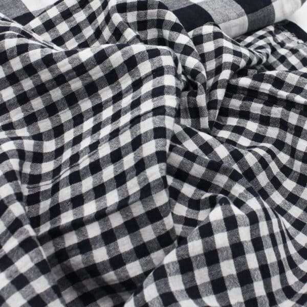 close up of black and white double gauze gingham fabric