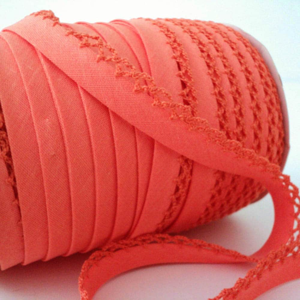 roll of orange picot lace edge bias binding