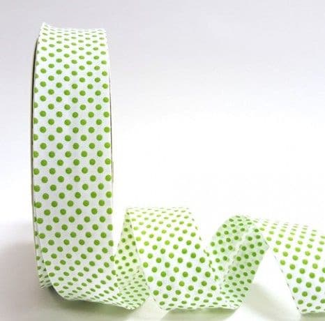 Roll of white and lime dot bias binding