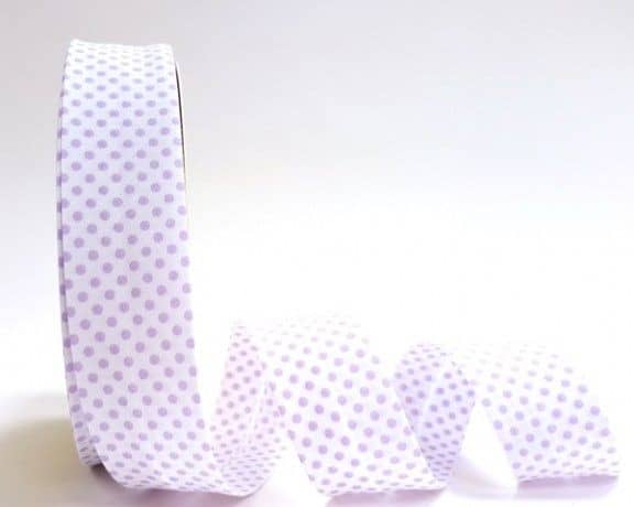 roll of white and lilac dot 30mm wide bias binding