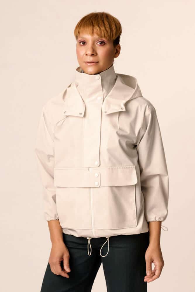 lady wearing cream cotton jacket with pockets and hood