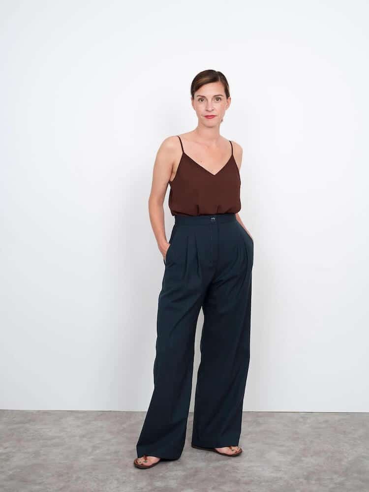 lady wearing wide leg, high waist trouser in black with dark red top