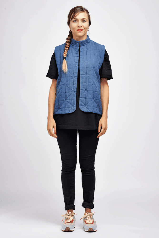 lady wearing a sleevess quilted blue gillet