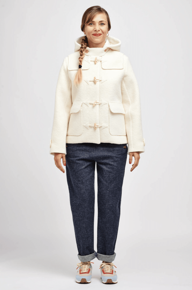 lady wearing a white wool duffle coat type jacket