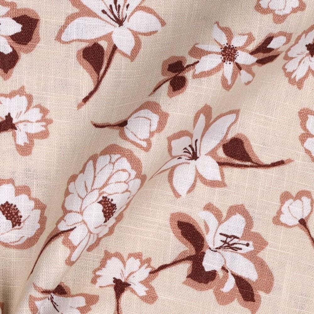 folded floral linen gingham fabric close up in cream