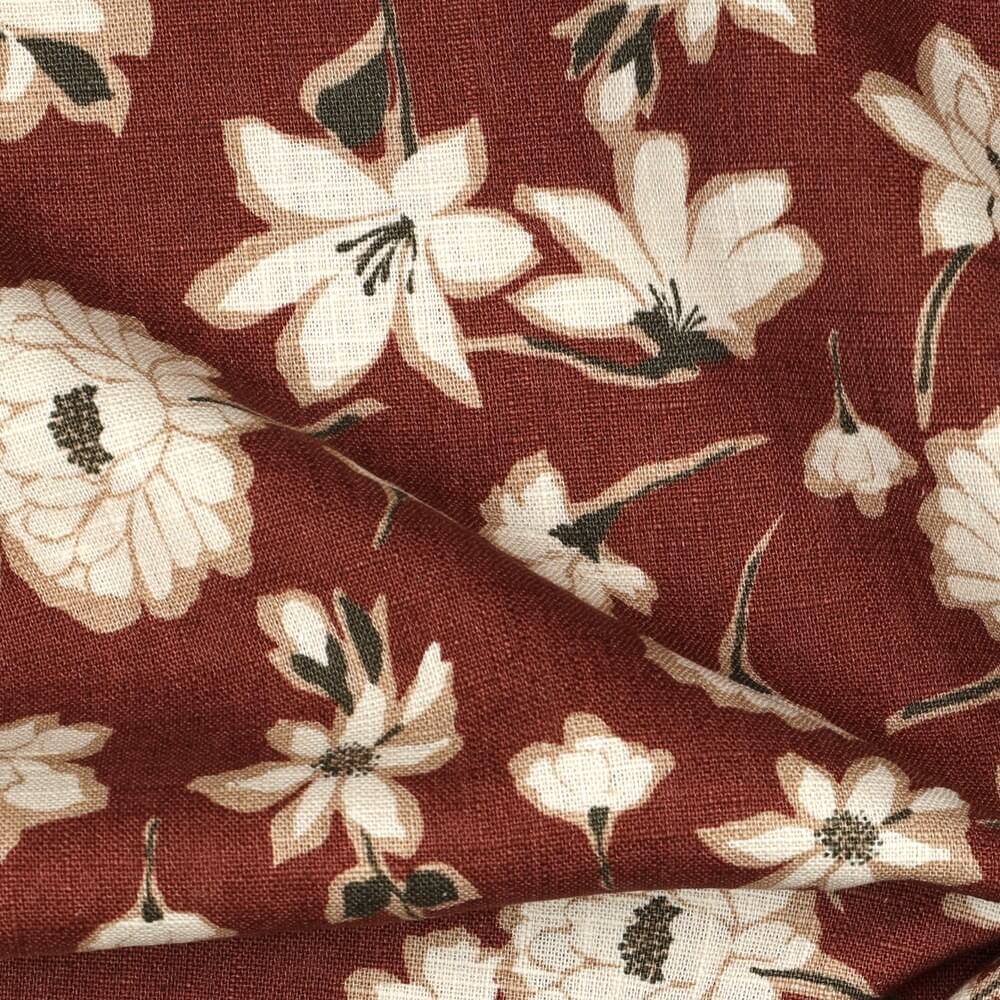 close up of a big floral linen print fabric in brown red