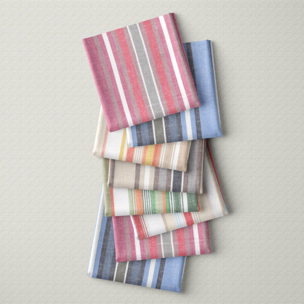 folded squares of linen and cotton stripe fabric place vertically in a row