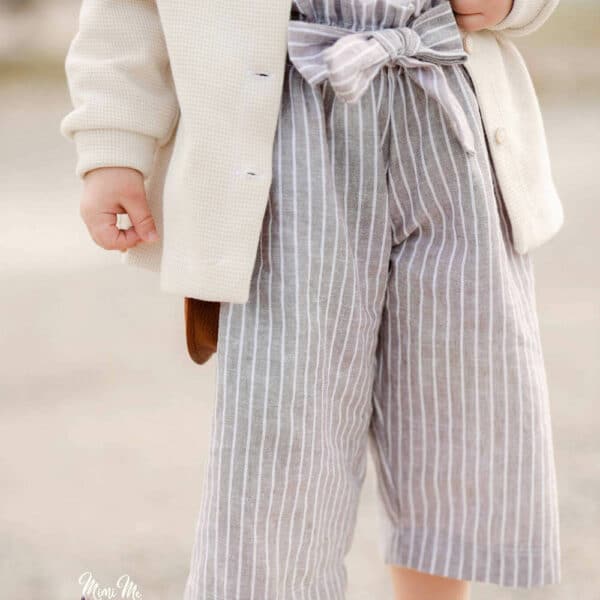 little boy wearing linen and cotton fabric shorts in grey