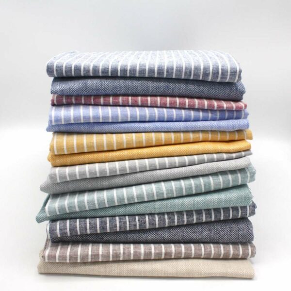 pile of matching linen and cotton fabric stripes