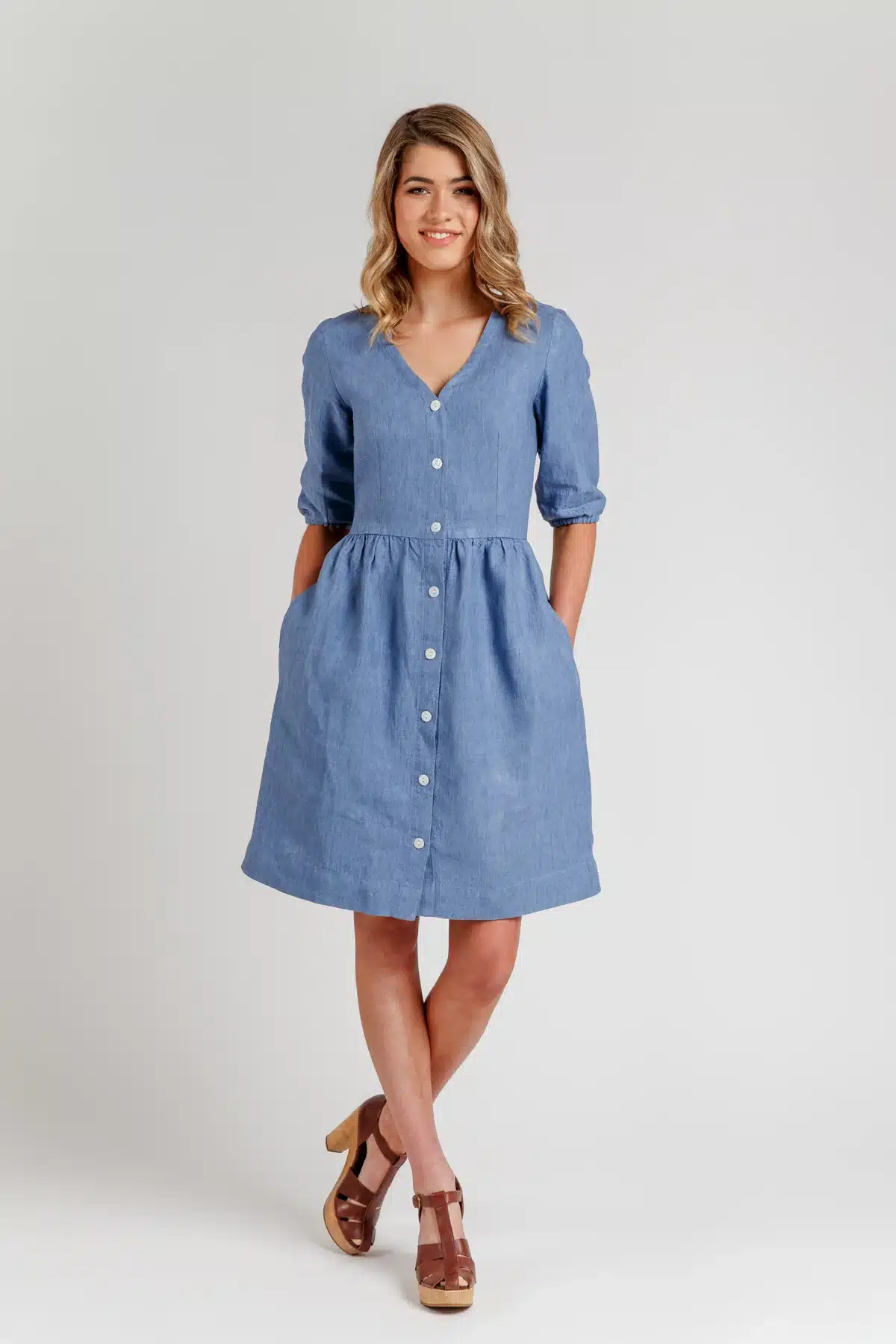 lady modelling an elbow length sleeve chambray dress in blue