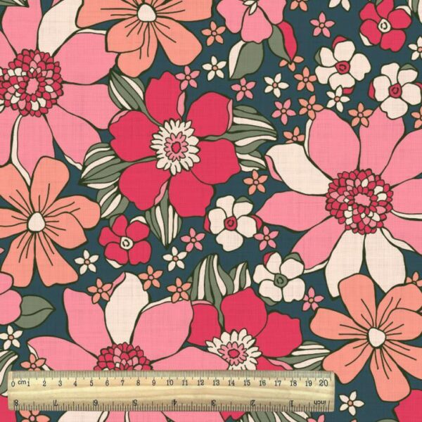 large brightly coloured pink mod floral fabric with ruler