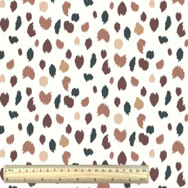 Irregular smudge spots on cream jersey from the Felyna collection of cotton prints with ruler