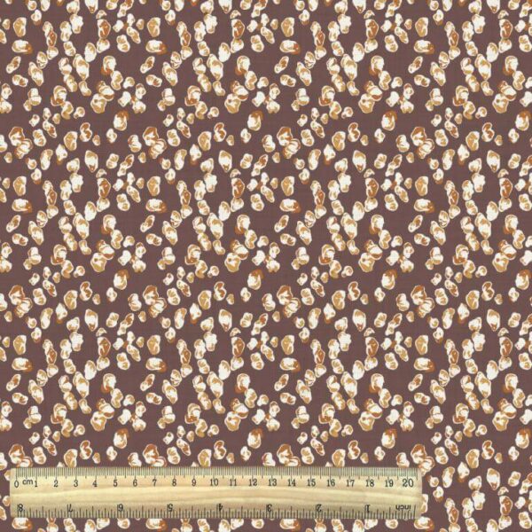vintage rustic pebble print cotton fabric from the Semara collection with ruler