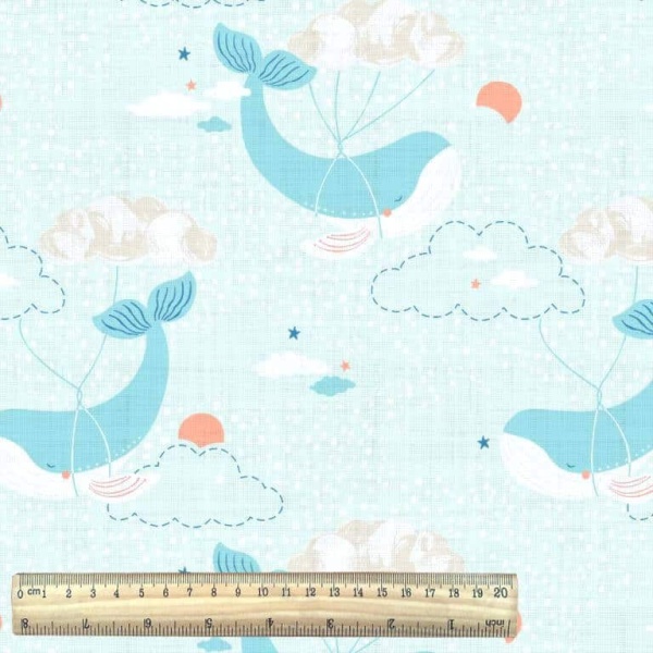 whale cotton fabric nursery print in blue and white with ruler