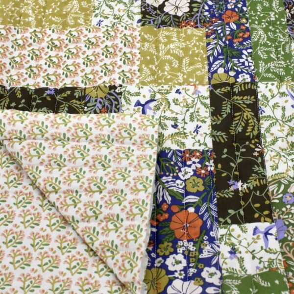 Quilted double sided cotton fabric in a patchwork design