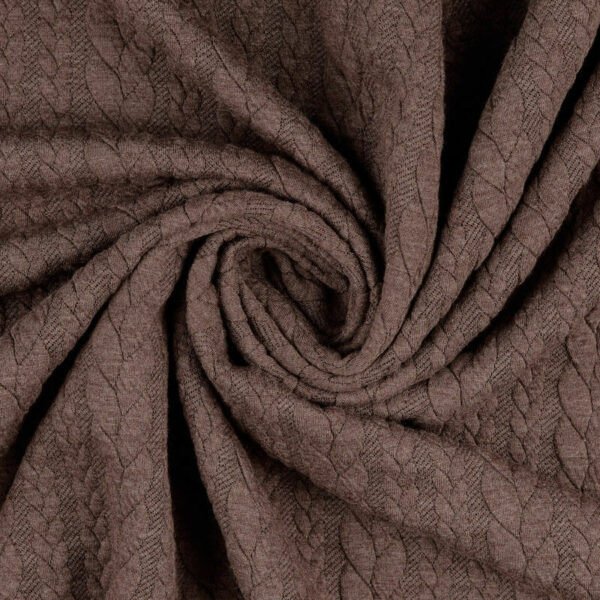 Brown cable knit jersey fabric in a swirl