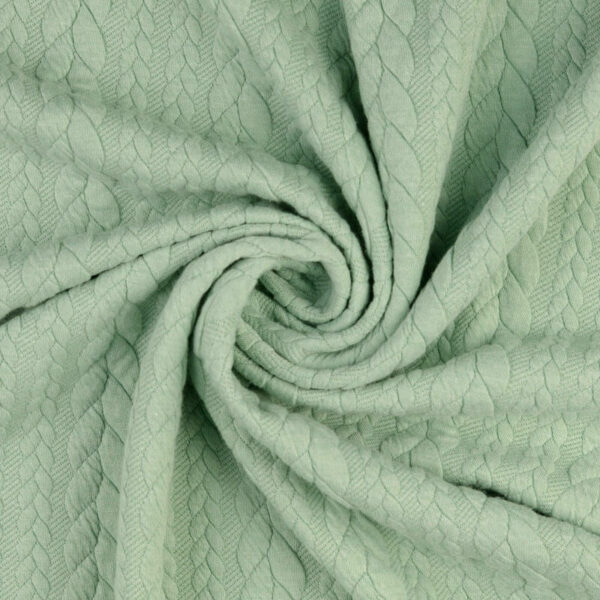 Mint cable knit jersey fabric in a swirl