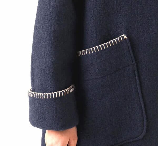 close up of boiled wool coat with blanket stitch
