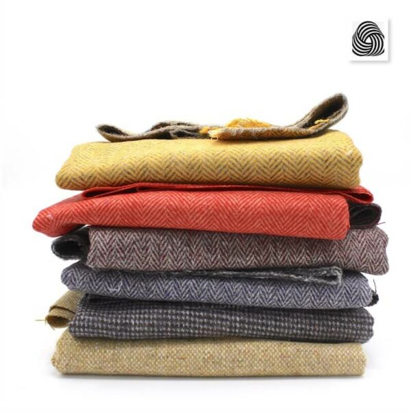 Pile of pure new wool tweed suitings deadstock