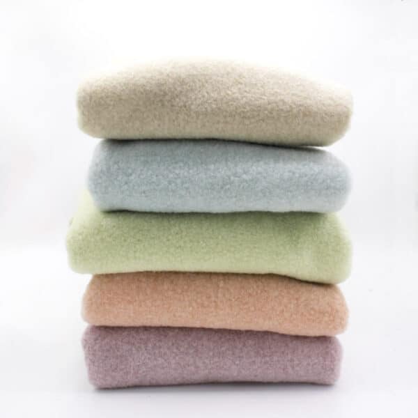Pile of felted boucle coating in all colours