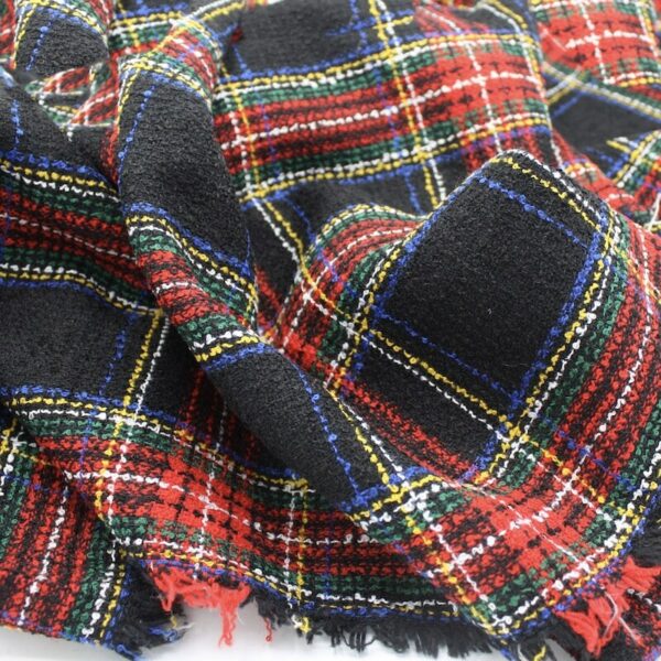 Close up of royal steward black tartan boucle fabric folded Image 1
