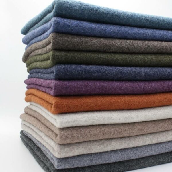 pile of melange coloured 100% boiled wool fabric