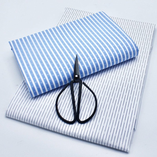 Deadstock shirting bundle of fabric with scissors