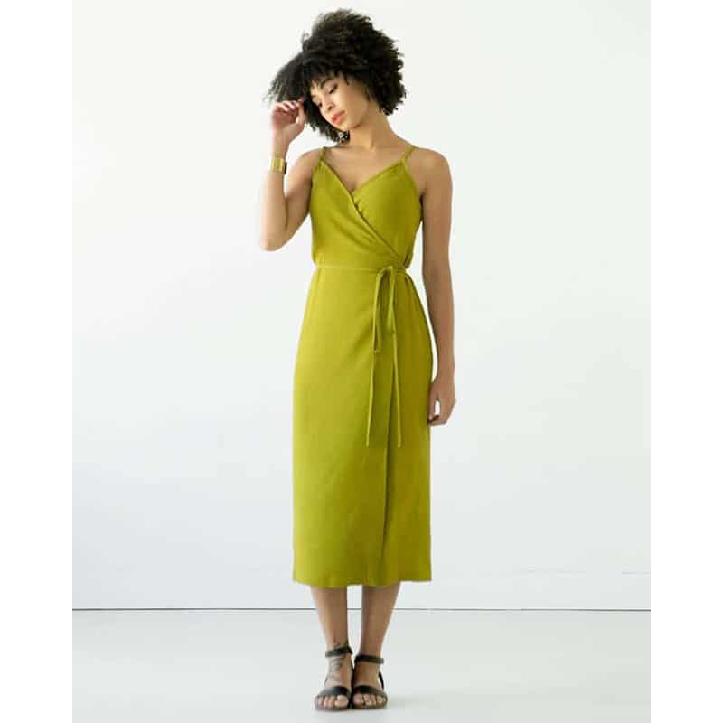 lady in lime dress on white background