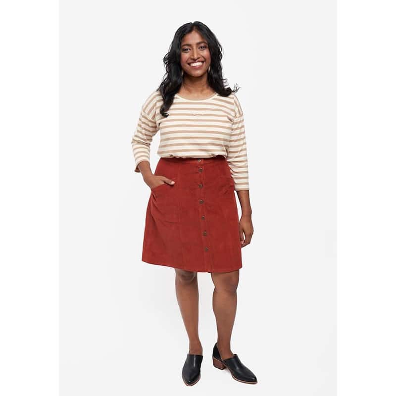 lady wearing stripey top and red skirt