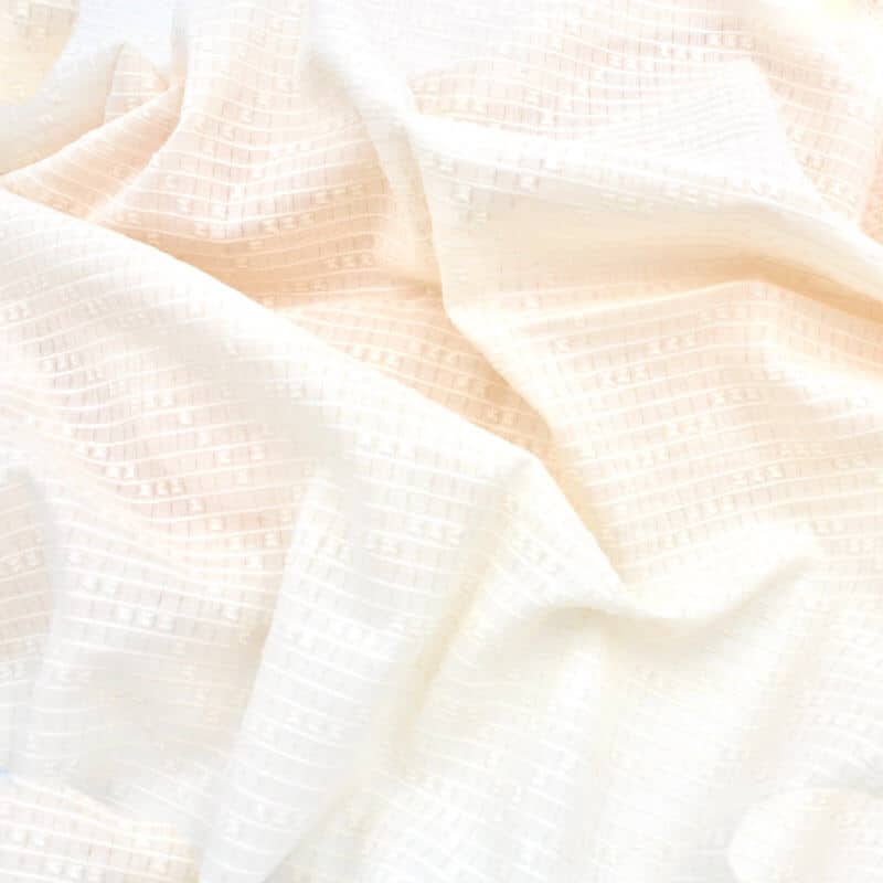 cotton dotted swiss domotex fabric in rich ecru