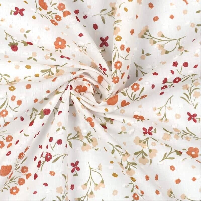 cotton floral dotted swiss fabric in orange floral
