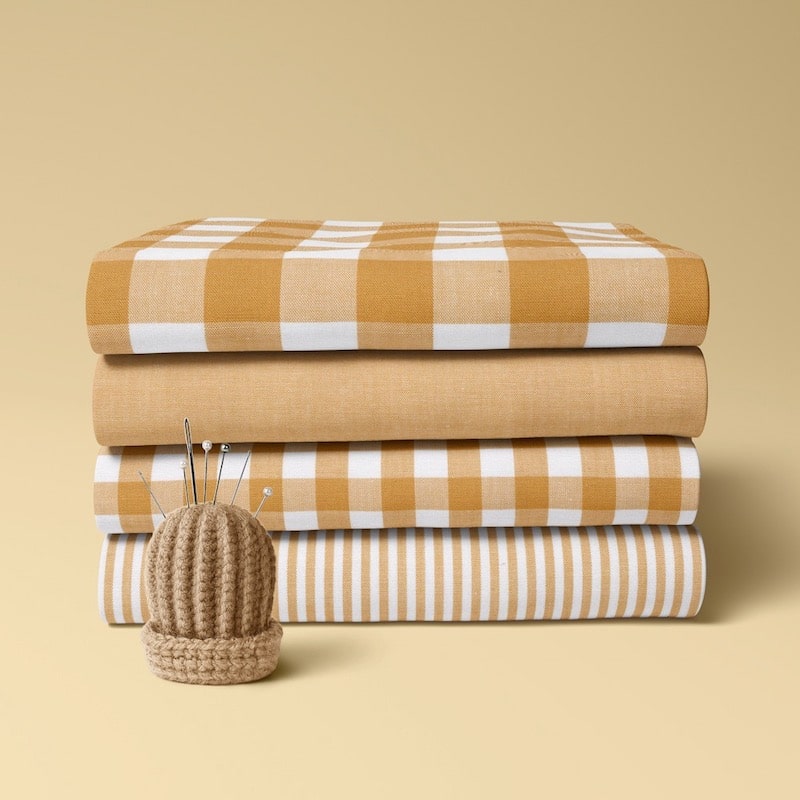 4 x folded cotton fabric bundle in ochre yellow
