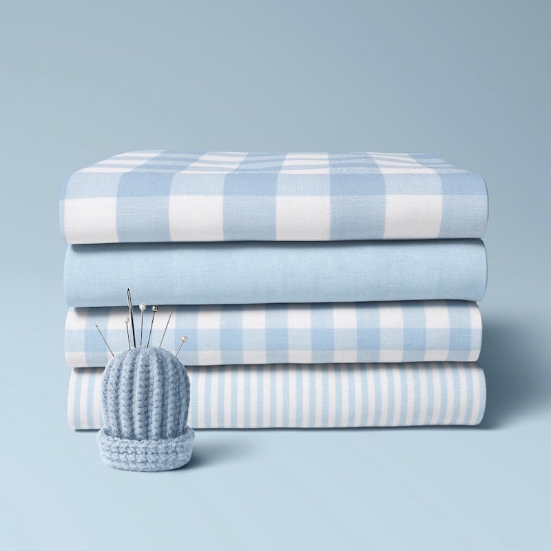 4 x folded cotton fabric bundle in pale blue