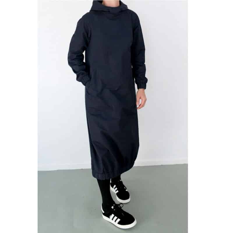 Fashion Model Wearing Assembly Line Sewing Pattern for Hoodie Dress | Intermediate XS - L